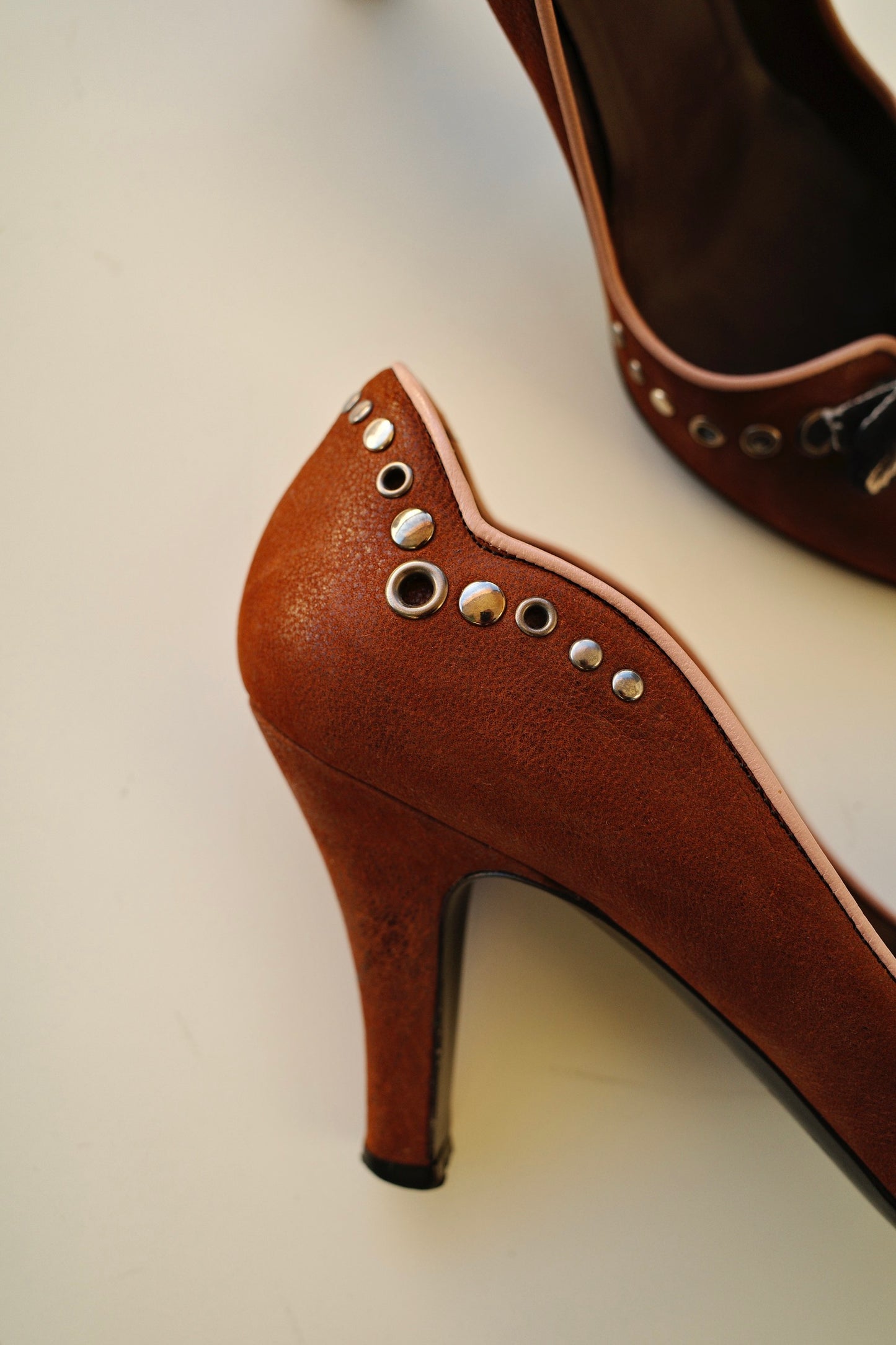 PRADA STUDDED LEATHER PUMPS