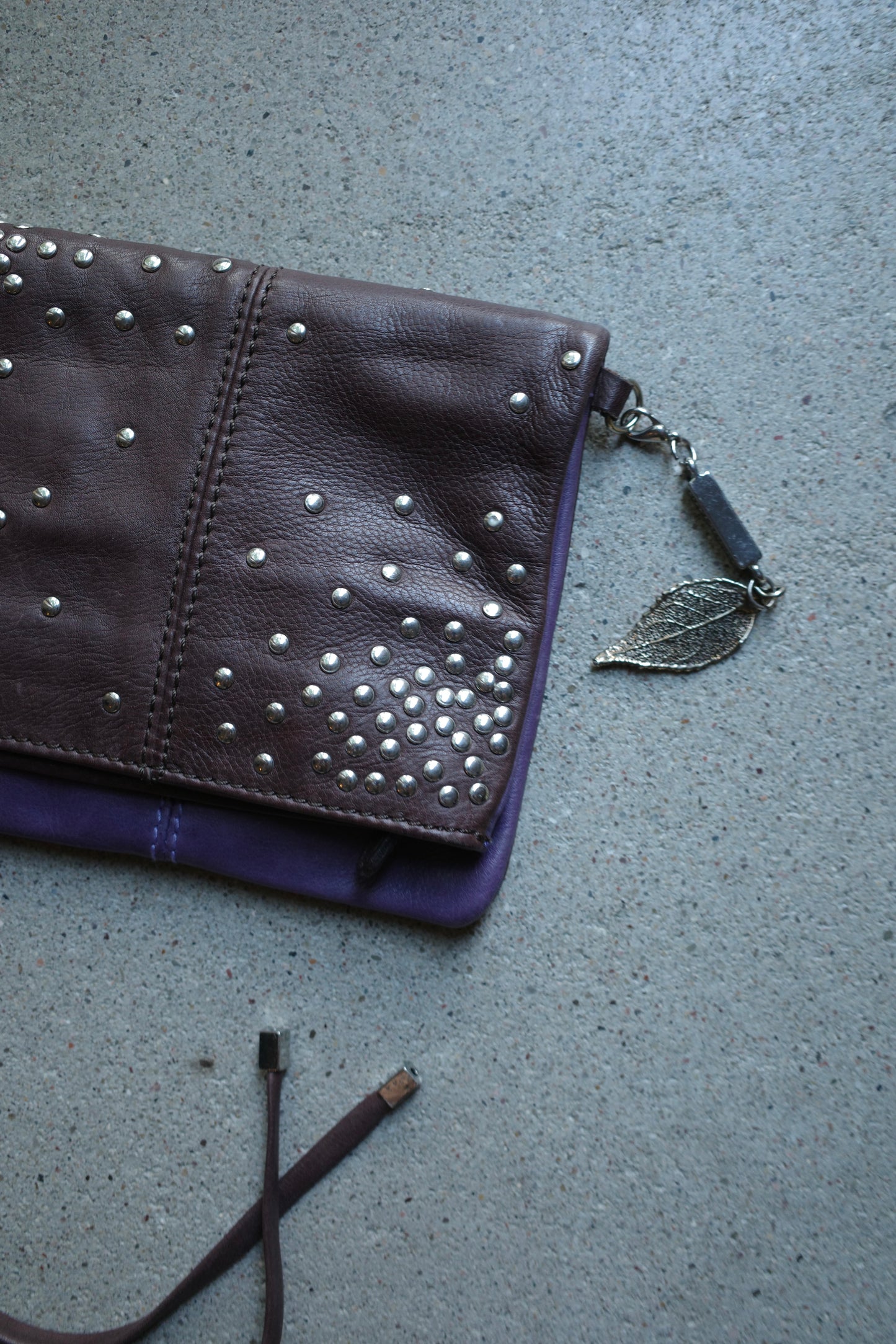 STUDDED MULTICOLOR LEATHER CLUTCH
